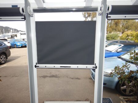 Small Ziptrak combination cafe blind with clear PVC and Visiontex Extreme in colour Ararat.
